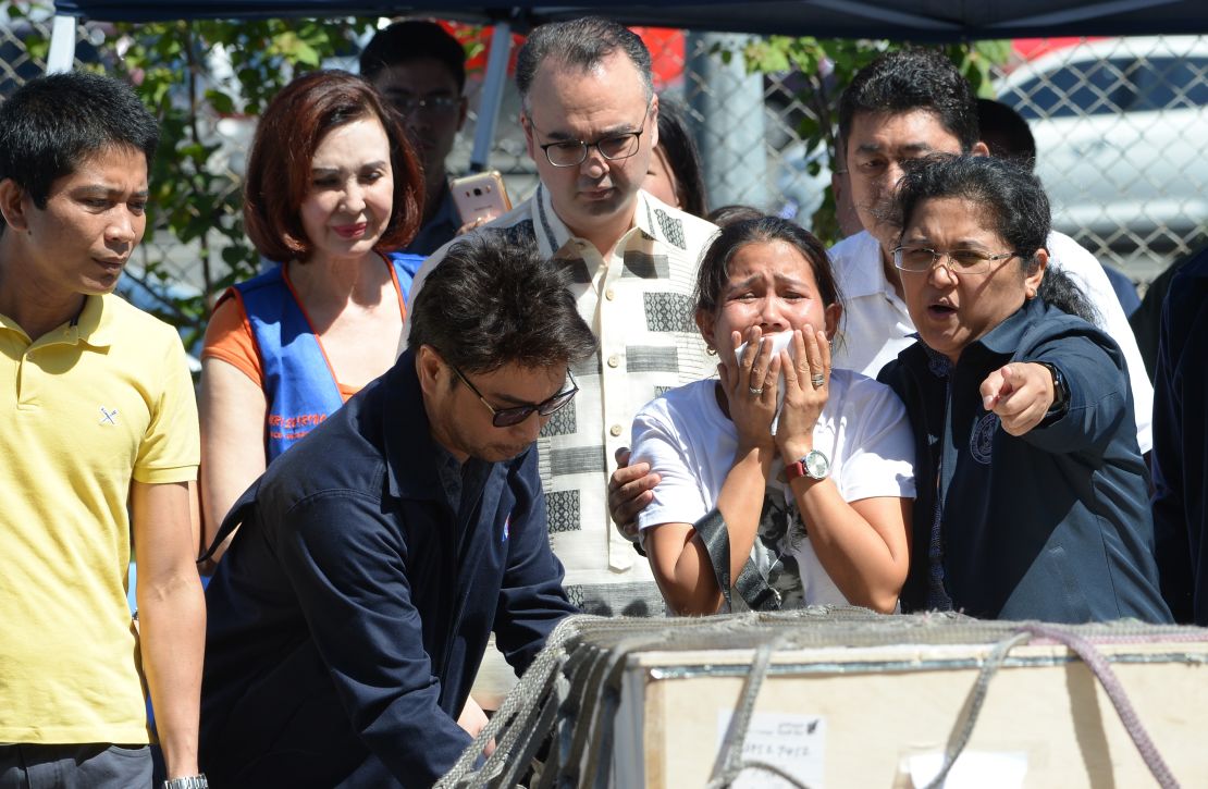 Jessica, sister of Filipina overseas worker Joanna Demafelis, cries near the casket shortly after its arrival in Manila on February 16.