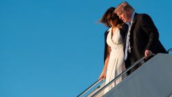 US President Donald Trump and First Lady Melania Trump arrive at Palm Beach International Airport in West Palm Beach, Florida, on February 16, 2018. / AFP PHOTO / JIM WATSON        (Photo credit should read JIM WATSON/AFP/Getty Images)