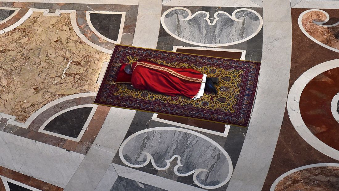 Pope Francis prays on the floor of St. Peter's Basilica while observing Good Friday in April 2015.