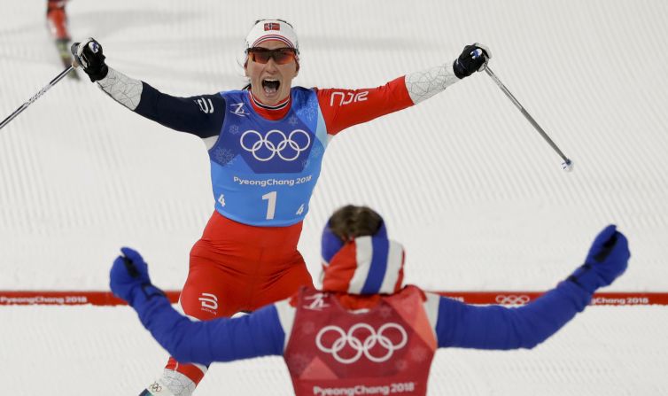 Marit Bj?rgen, top, celebrates with Ingvild Flugstad ?stberg after Norway won a cross-country relay. With the victory, Bj?rgen became the most decorated Winter Olympian ever. She now has 13 Olympic medals, tying her with Norwegian biathlete Ole Einar Bj?rndalen.