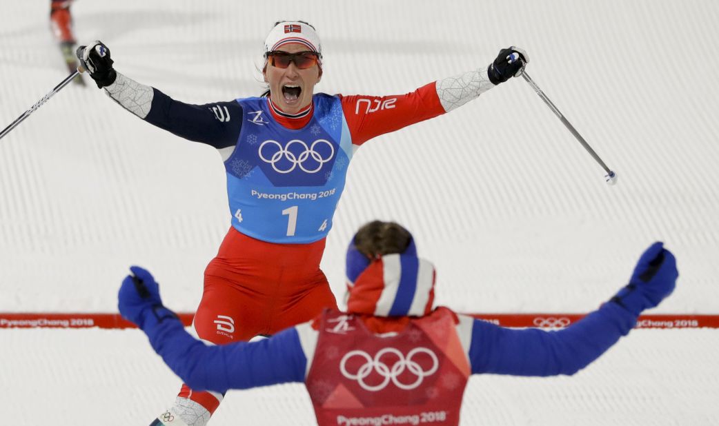 Marit Bjørgen, top, celebrates with Ingvild Flugstad Østberg after Norway won a cross-country relay. With the victory, Bjørgen became the most decorated Winter Olympian ever. She now has 13 Olympic medals, tying her with Norwegian biathlete Ole Einar Bjørndalen.