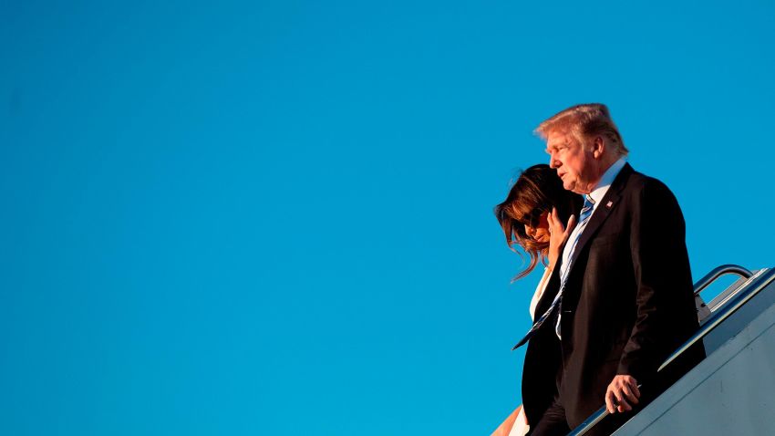 US President Donald Trump and First Lady Melania Trump arrive at Palm Beach International Airport in West Palm Beach, Florida, on February 16, 2018. / AFP PHOTO / JIM WATSON        (Photo credit should read JIM WATSON/AFP/Getty Images)