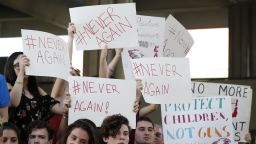 Protesters hold signs at a rally for gun control at the Broward County Federal Courthouse in Fort Lauderdale, Florida on February 17, 2018. 
