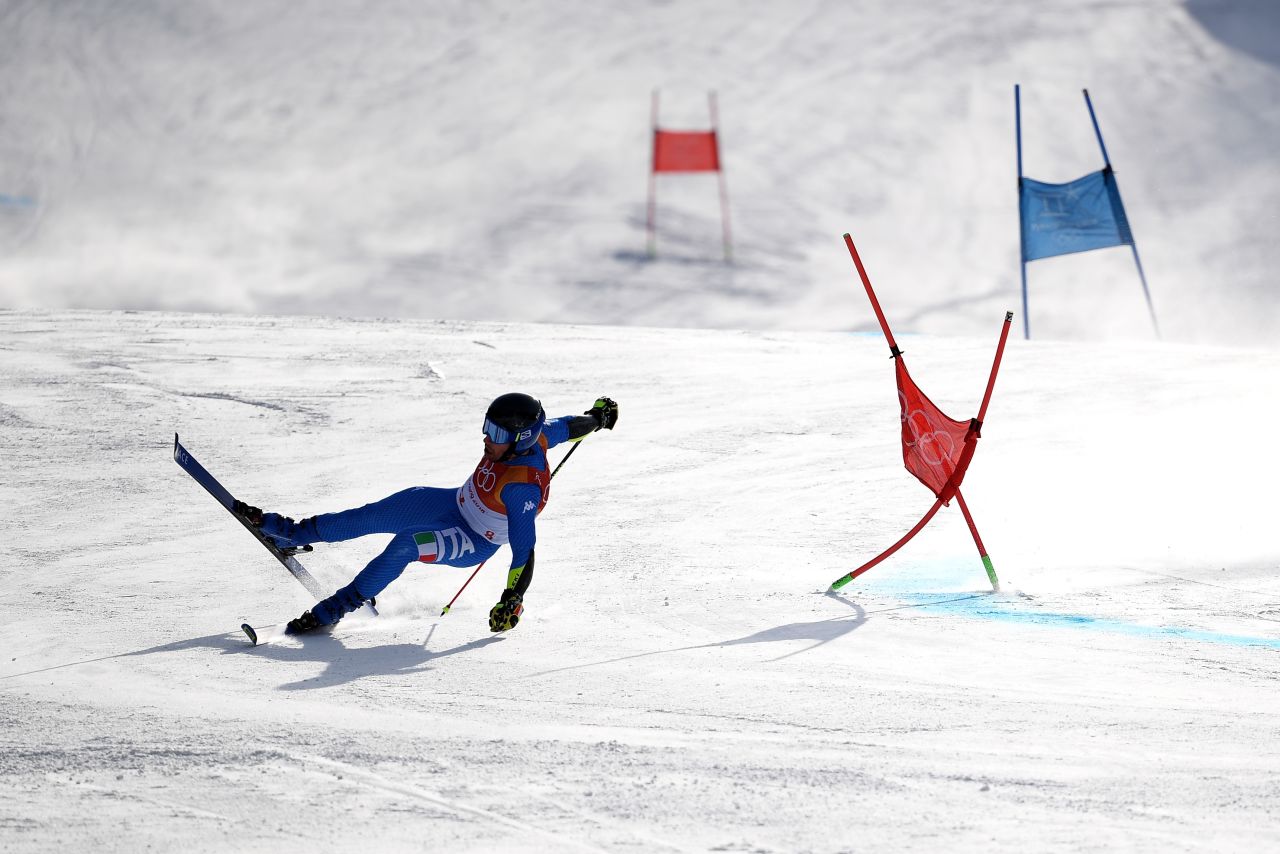 Luca De Aliprandini of Italy crashes during the men's giant slalom.
