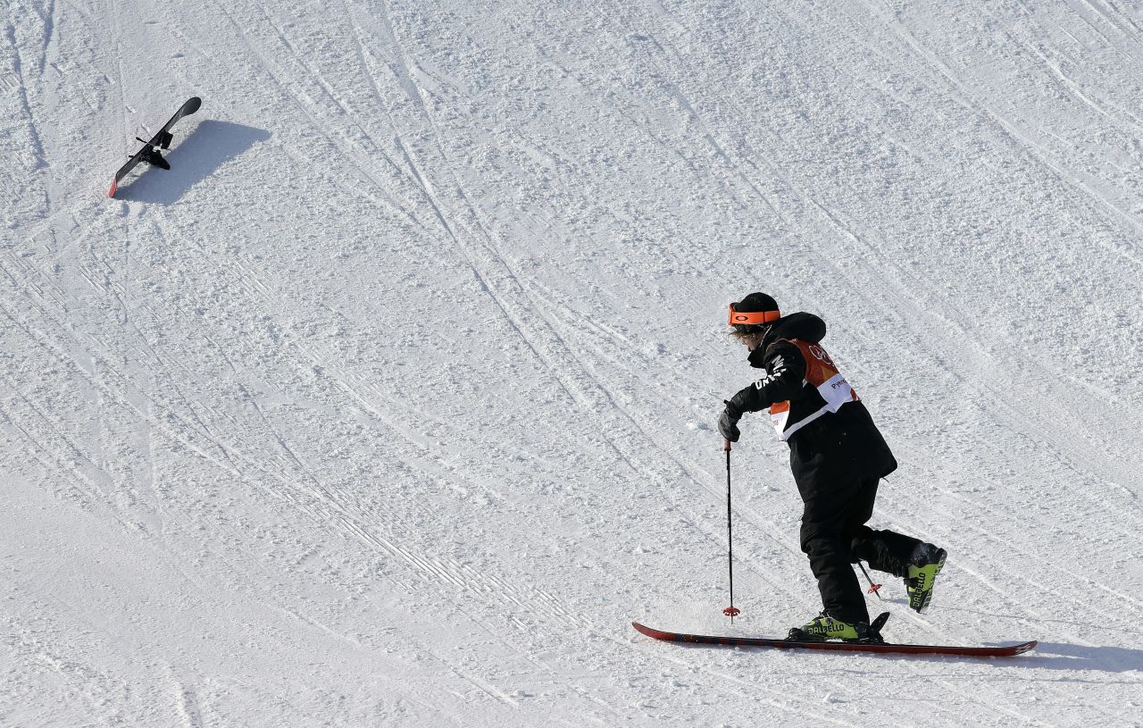 Finn Bilous, of New Zealand, gets up after crashing during the men's slopestyle freestyle skiing.