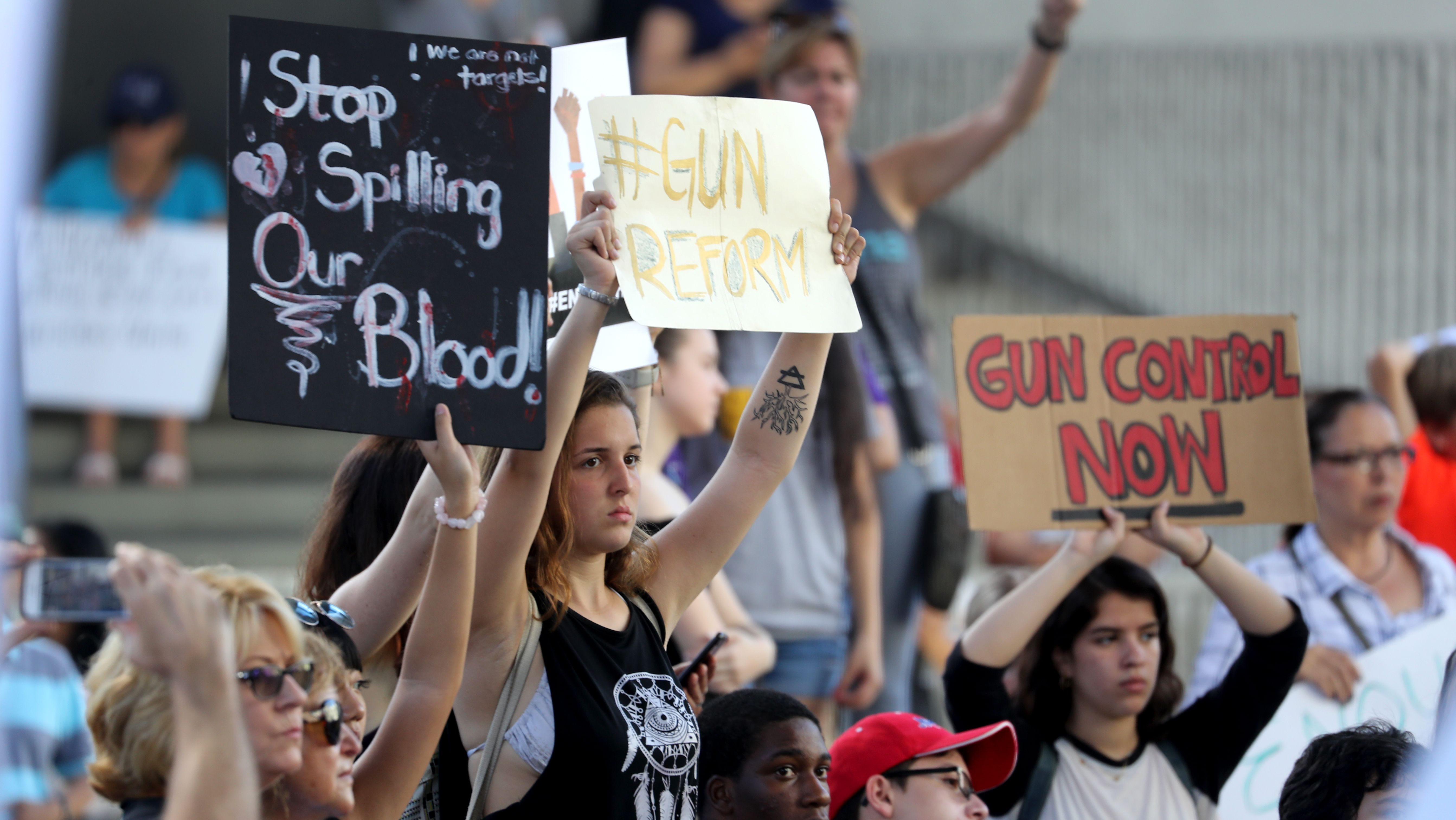 Protesters attend a rally at the Federal Courthouse in Fort Lauderdale, Fla., to demand government action on firearms, on Saturday, Feb. 17, 2018. Their call to action is a response the massacre at Marjory Stoneman Douglas High School in Parkland, Fla. (Mike Stocker/Sun Sentinel/TNS via Getty Images)