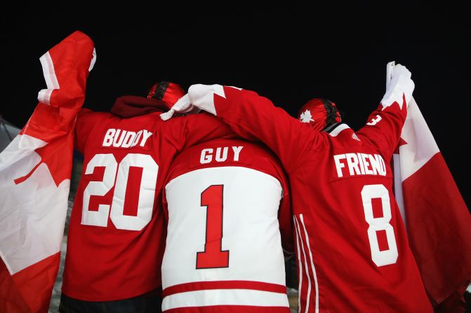 Canadian fans watch two-man bobsleigh heats.