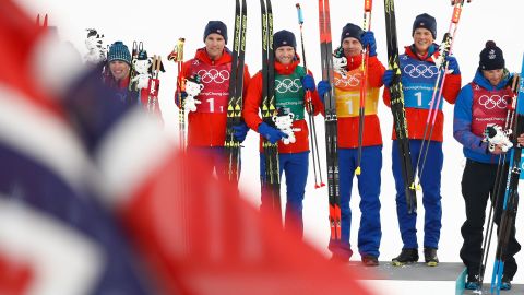 Team Norway celebrate winning gold during the victory ceremony on the podium during the men's 4x10kms classic freestyle cross country relay.