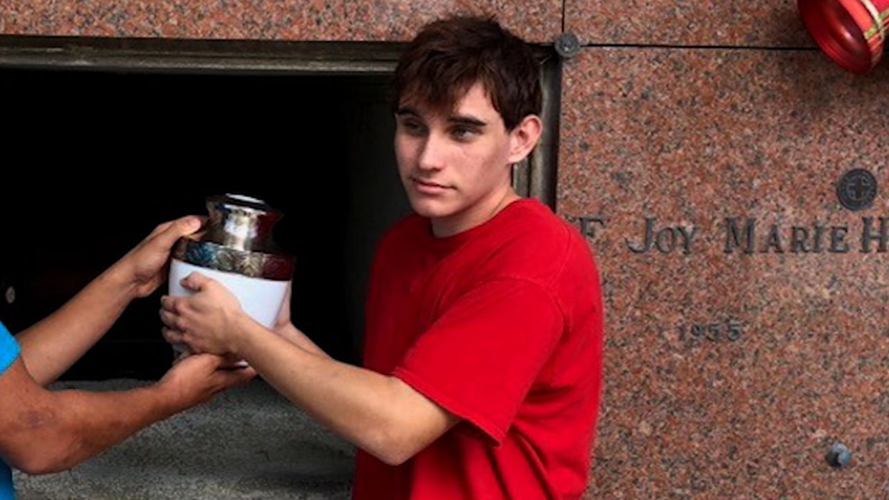 Nikolas Cruz at Lynda Cruz's funeral, with an urn of his mother's ashes.