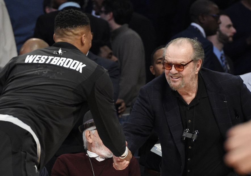 Westbrook shakes hands with Los Angeles' most famous NBA fan, actor Jack Nicholson.