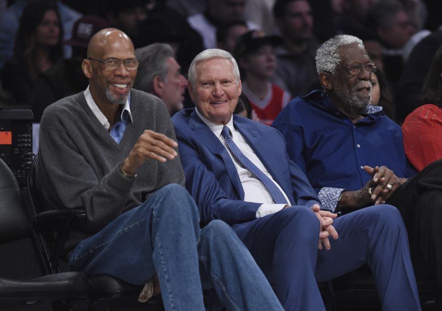 From left, NBA legends Kareem Abdul-Jabbar, Jerry West and Bill Russell watch the game from courtside.