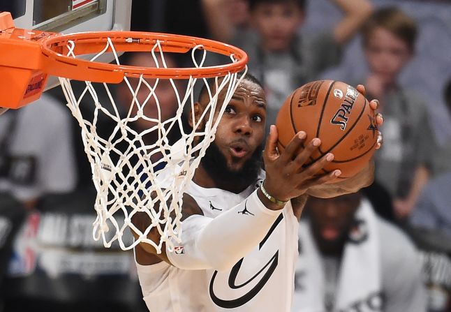 James rises for one of his several dunks in the game.