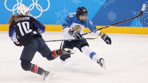 Finland's Ronja Savolainen, right, collides with American Meghan Duggan during their hockey semifinal.