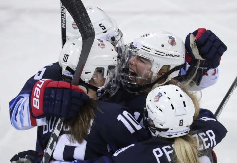 Gigi Marvin, top right, celebrates with her American teammates after scoring the opening goal against Finland. Team USA won 5-0 to advance to the final.