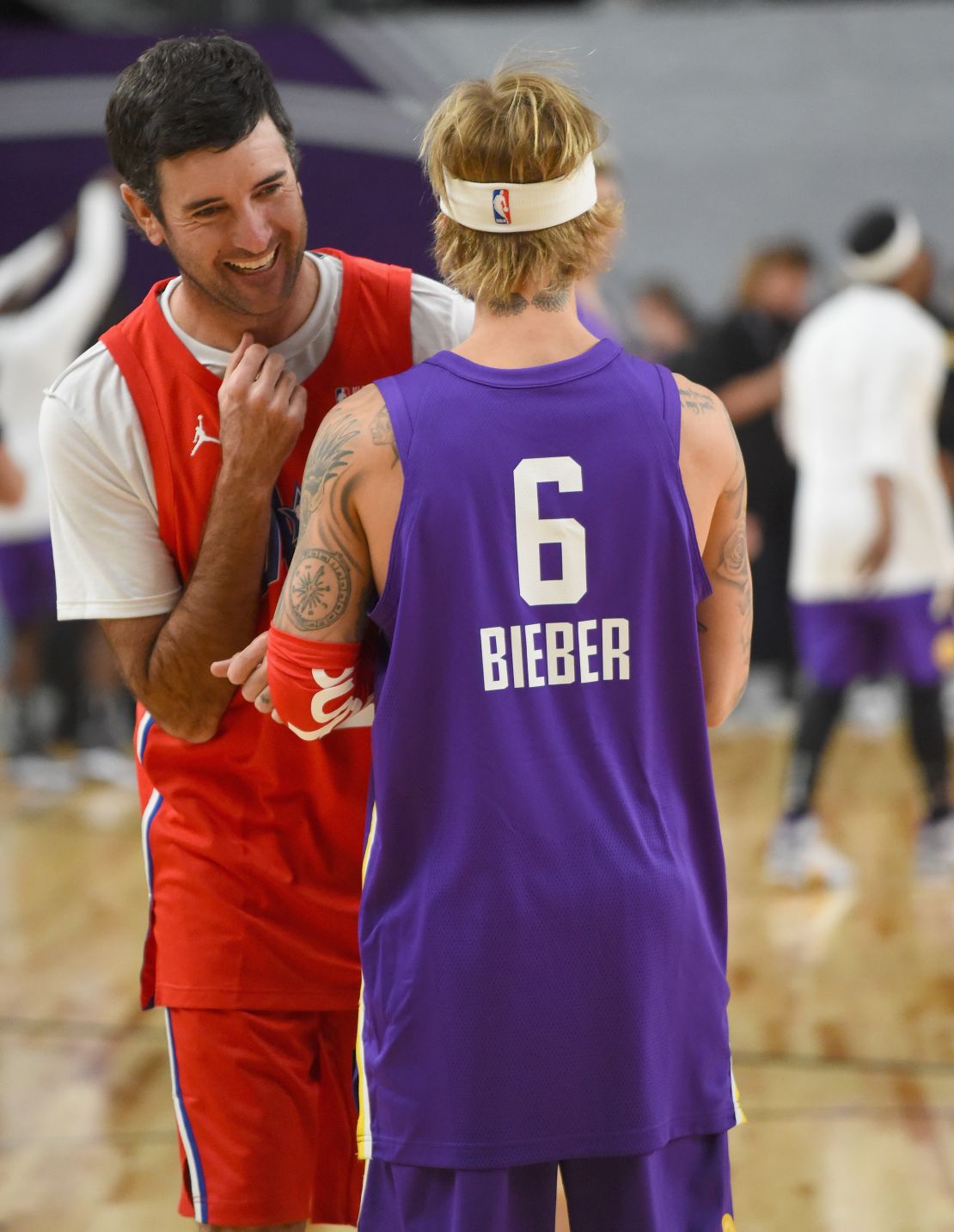 Bubba Watson has a laugh with Justin Bieber during warm-up prior to the 2018 NBA All-Star Celebrity Game at Los Angeles Convention Center.