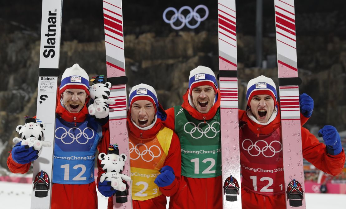 Gold medallists Norway's Daniel Andre Tande, Andreas Stjernen, Johann Andre Forfang and Robert Johansson celebrate during the victory ceremony in the men's large hill team ski jumping final round.