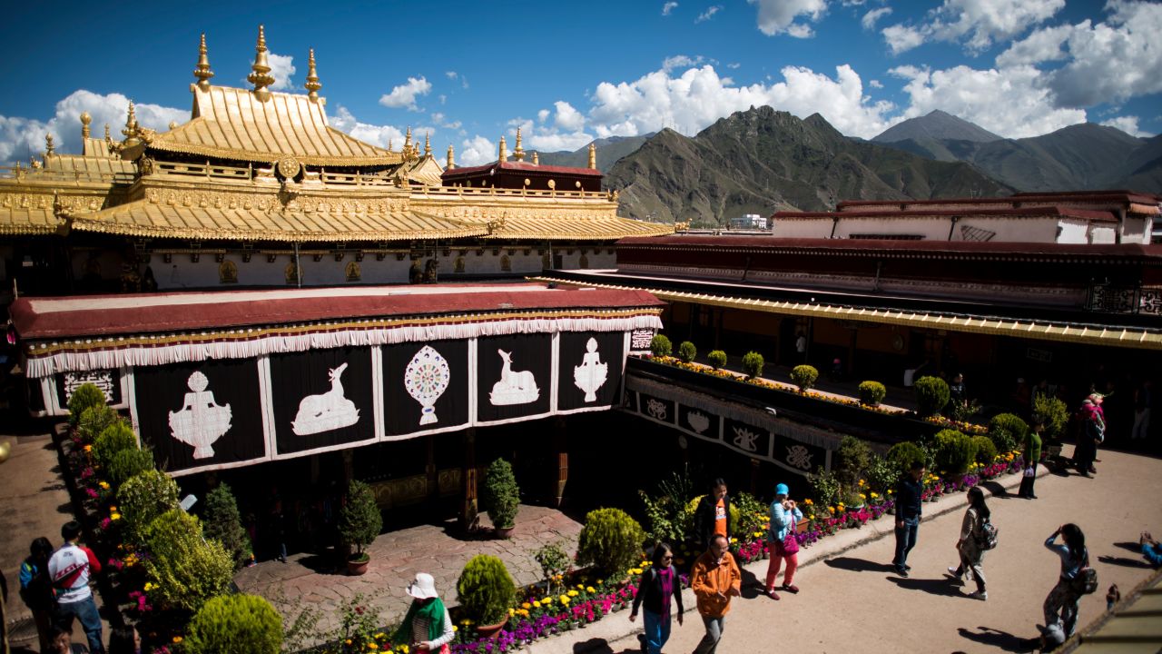 Chinese tourists on the roof of the Jokhang Temple in the regional capital Lhasa, in China's Tibet Autonomous Region, in September 2016.