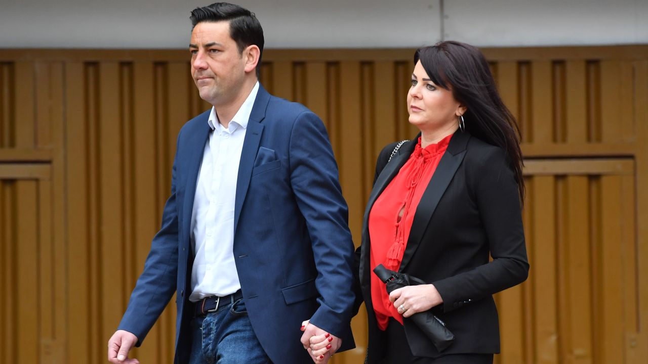 Former footballer Andy Woodward (L) arrives with his partner Zelda (R) at court on Monday.