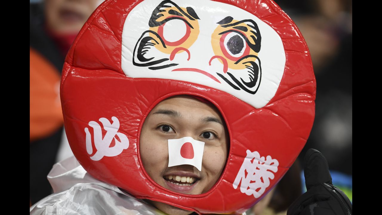 A Japan supporter watches the ski jumping competition.