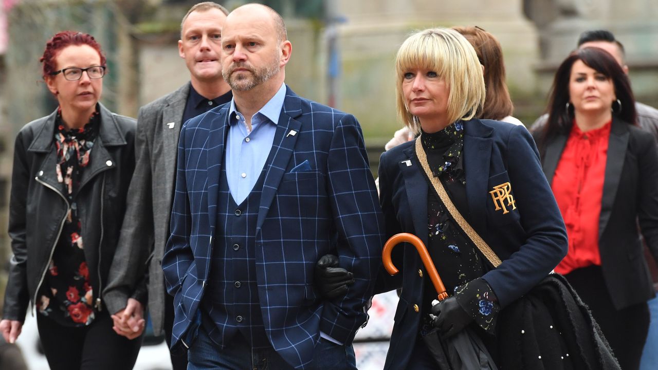 Ex-Manchester City youth football player Chris Unsworth (C) arrives at court on Monday.