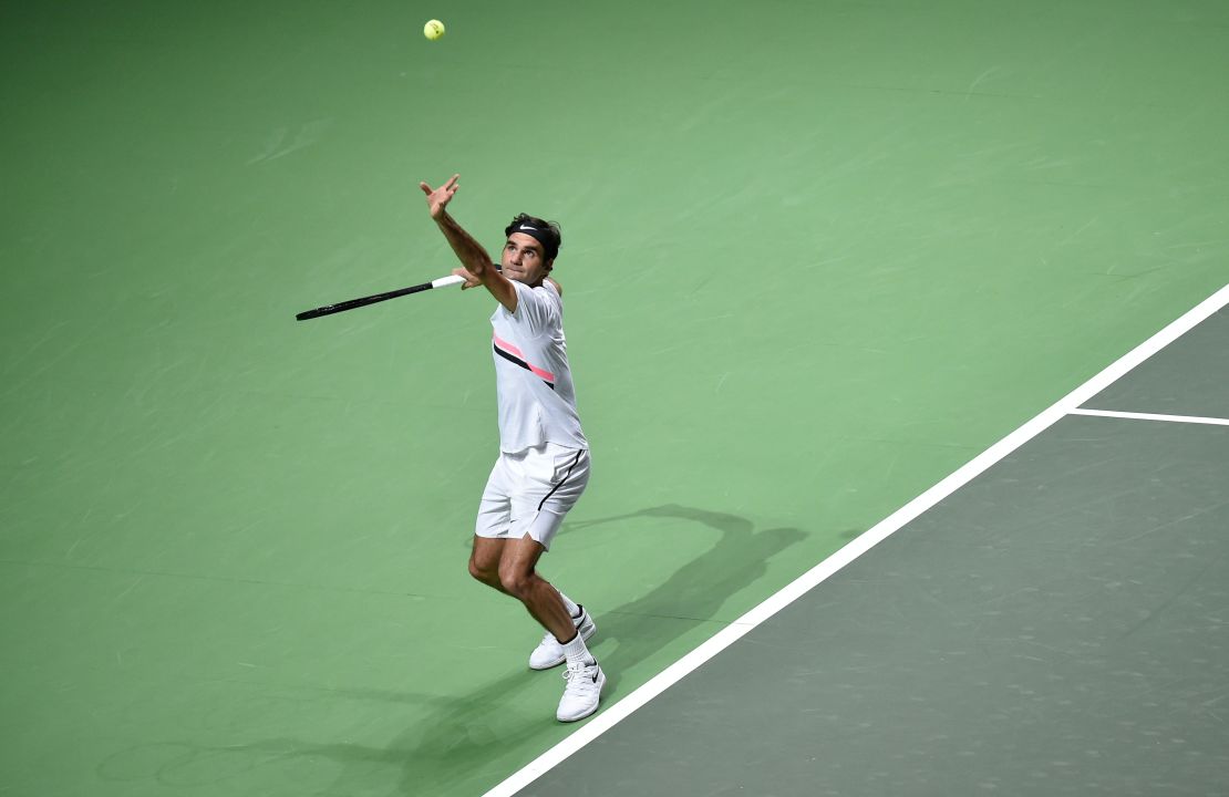Switzerland's Roger Federer serves to Robin Haase of the Netherlands  during their Rotterdam Open quarter-final.