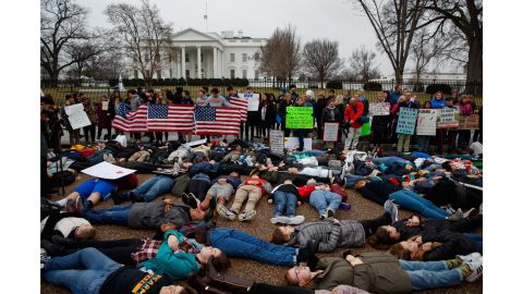 Demonstrators participate in a "lie-in" Monday in favor of gun-control reform outside the White House. 