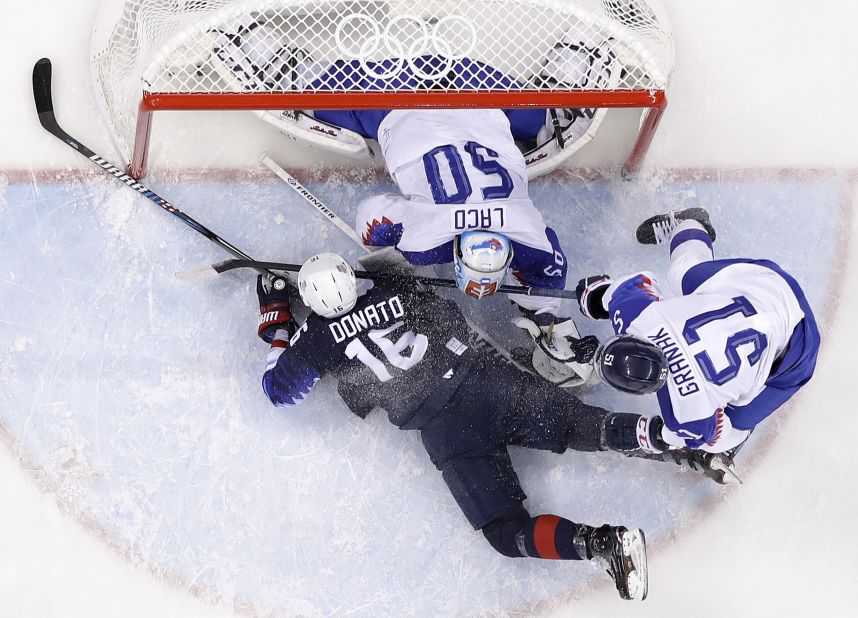 US forward Ryan Donato falls into the crease during the game against Slovakia. Donato had two goals as the Americans won 5-1 and advanced to the quarterfinals.