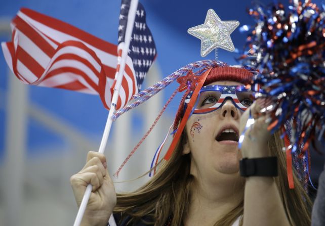 A fan cheers for Team USA before the men's hockey game against Slovakia.