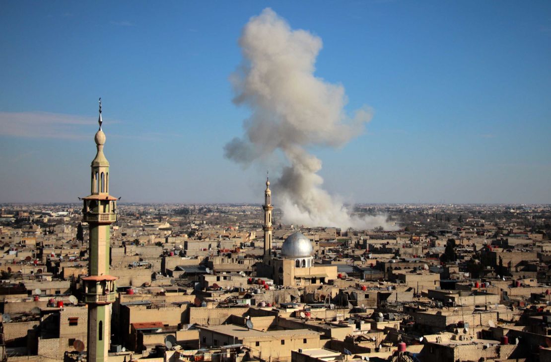 Smoke rises from buildings in Mesraba, Eastern Ghouta, after a bombardment on Monday.