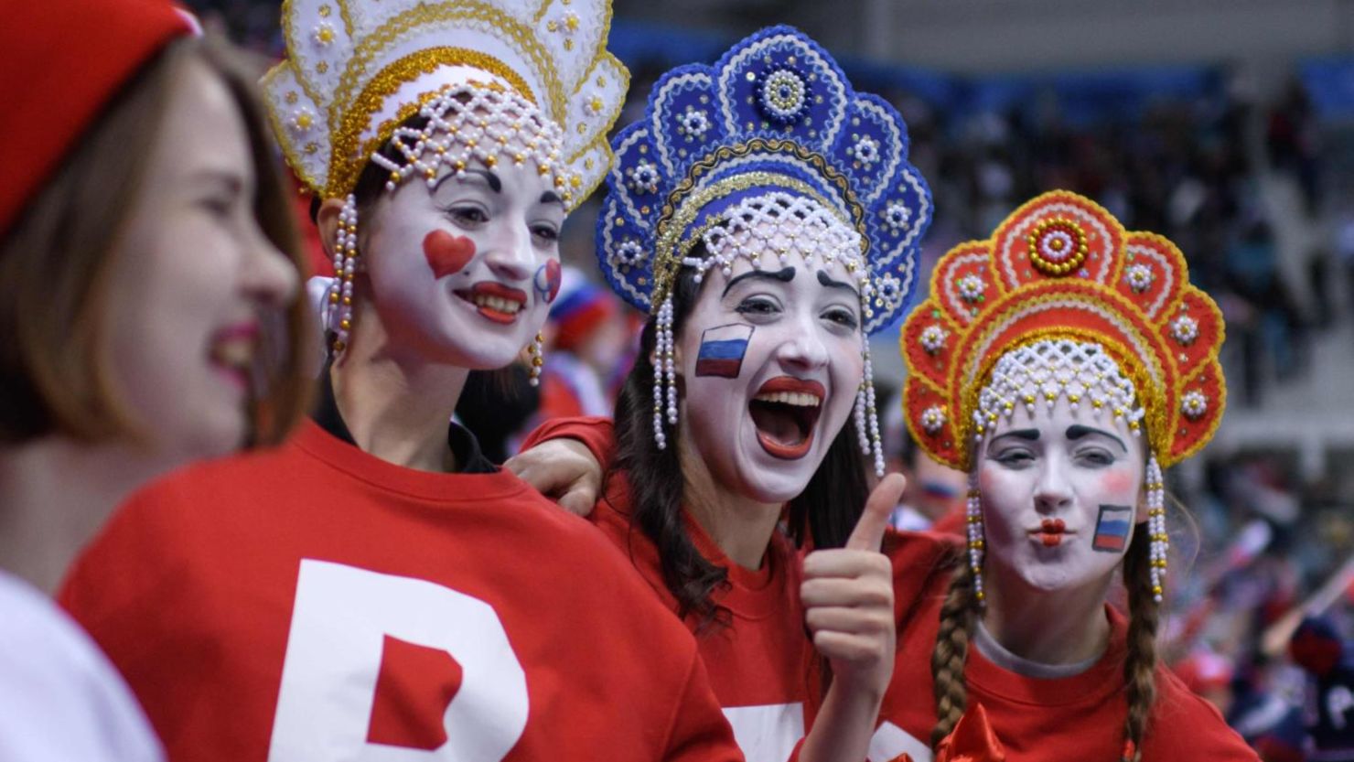 TOPSHOT - Fans cheers before the men's ice hockey preliminary round group B game between the Olympic Athletes from Russia and the United States during the Pyeongchang 2018 Winter Olympic Games at the Gangneung Hockey Centre in Gangneung on February 17, 2018. / AFP PHOTO / Ed JONES        (Photo credit should read ED JONES/AFP/Getty Images)