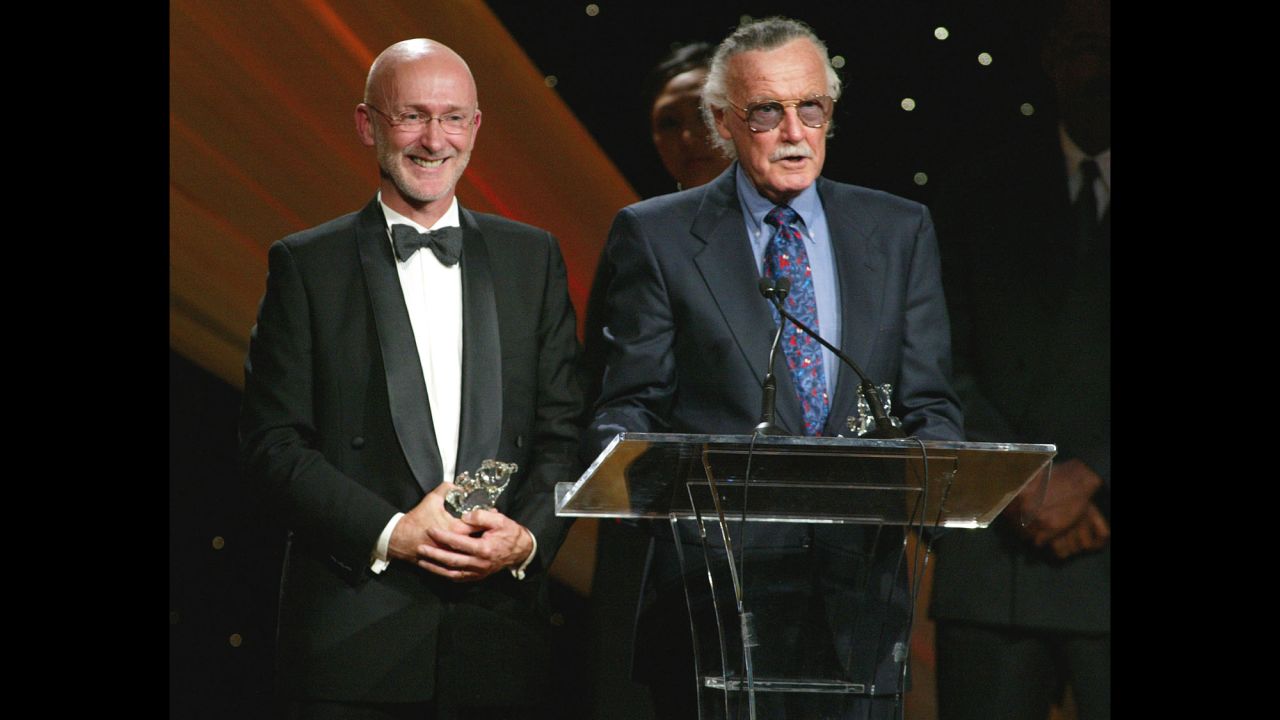 Lee and film producer Ian Bryce accept a Faith and Values Award for the "Spider-Man" film in 2003.