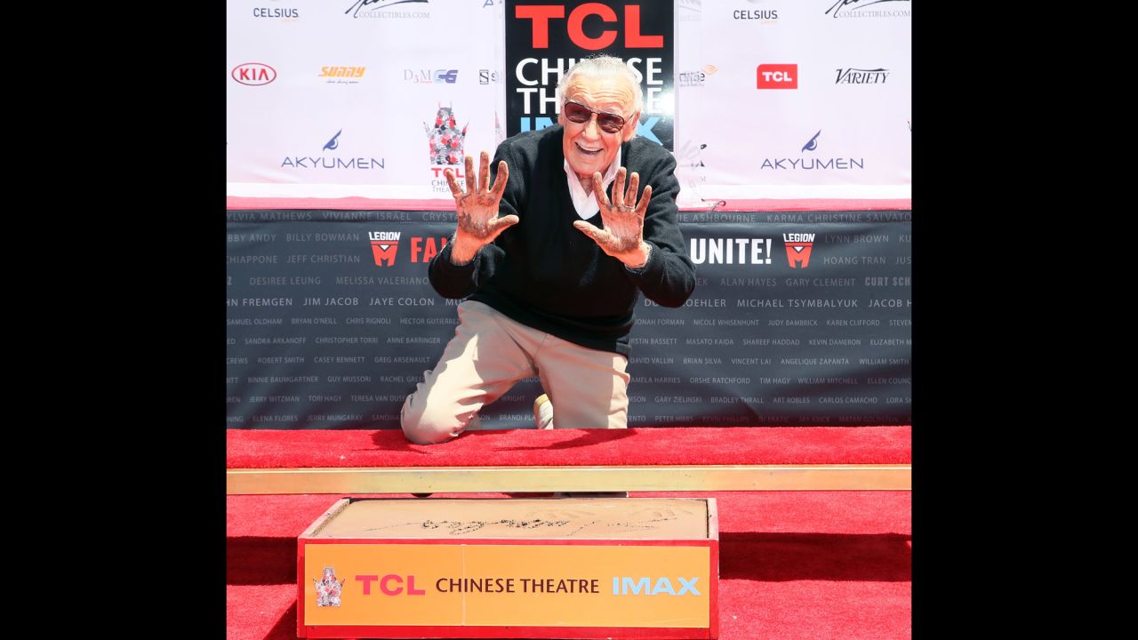 Lee leaves his handprints and footprints outside the TCL Chinese Theatre in Hollywood in July 2017.