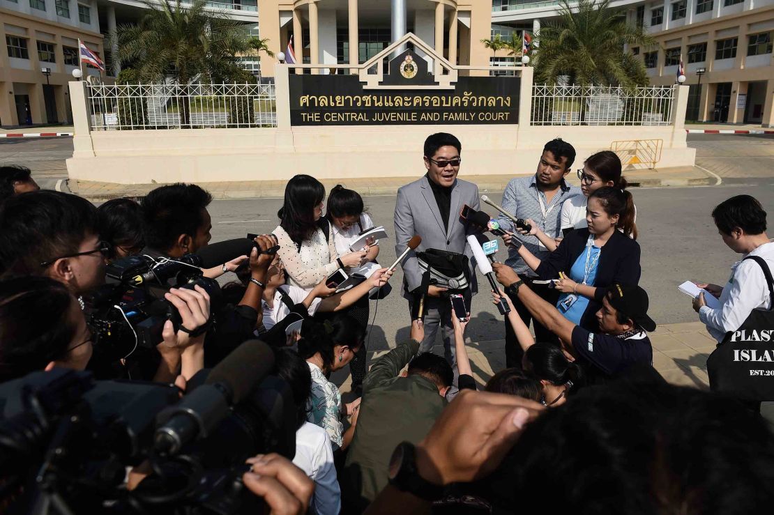 Thai lawyer Kong Suriyamontol speaks to the press after his client was granted paternity rights to his 13 children. 