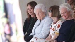LONDON, ENGLAND - FEBRUARY 20:  Queen Elizabeth II attends the Richard Quinn show with Chief Executive of the British Fashion Council Caroline Rush (L) and Conde Nast Artistic Director Anna Wintour during London Fashion Week February 2018 at BFC Show Space on February 20, 2018 in London, England.  (Photo by Mike Marsland/Mike Marsland/WireImage)