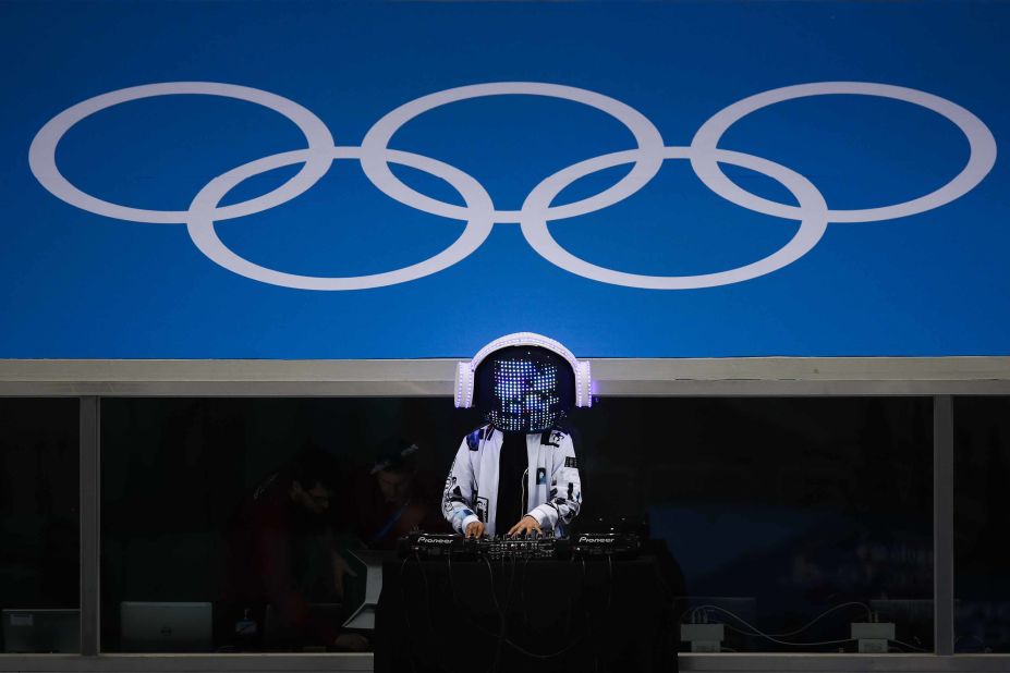 A DJ performs before the men's hockey game between Norway and Slovenia.