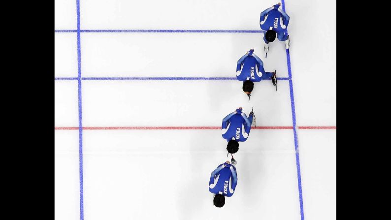 South Korean speedskaters train for a team pursuit race.