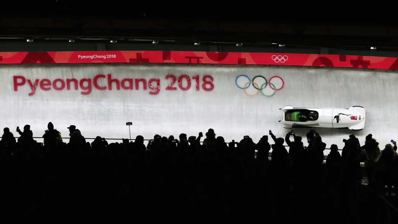 Jazmine Fenlator-Victorian and Carrie Russell of Jamaica compete during the women' bobsleigh heats.