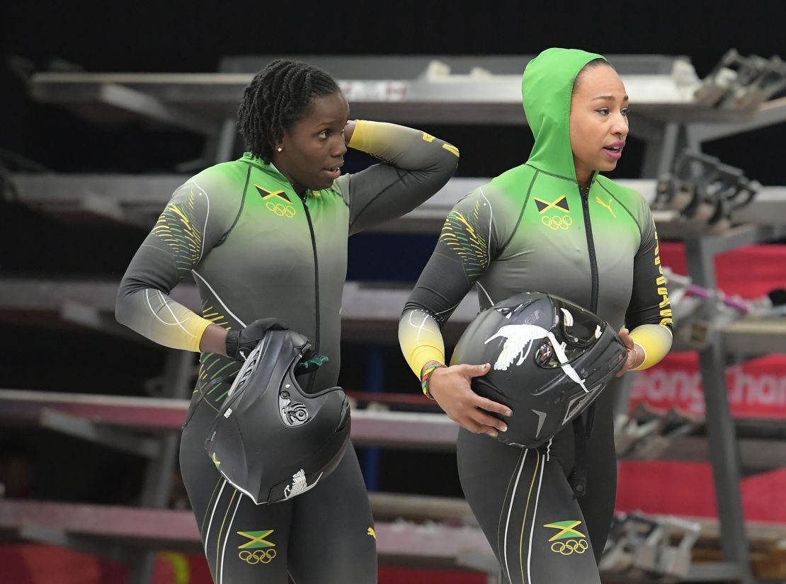 Jamaica's Jazmine Fenlator-Victorian, right, and Carrie Russell walk off the track after a bobsled run in the Winter Olympic Games on February 20.