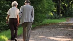 elderly couple walking STOCK