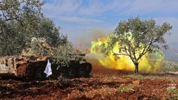 Turkish-backed Syrian rebel fighters fire from the town of Salwah, less than 10 kilometres from the Syria-Turkey border, towards Kurdish forces from the People's Protection Units (YPG) in the Afrin region, on February 19, 2018.
Turkey's foreign minister warned against any intervention by Syrian pro-government forces alongside Kurdish militias in northern Syria, saying it would not prevent Ankara from continuing its month-old offensive. / AFP PHOTO / OMAR HAJ KADOUR        (Photo credit should read OMAR HAJ KADOUR/AFP/Getty Images)