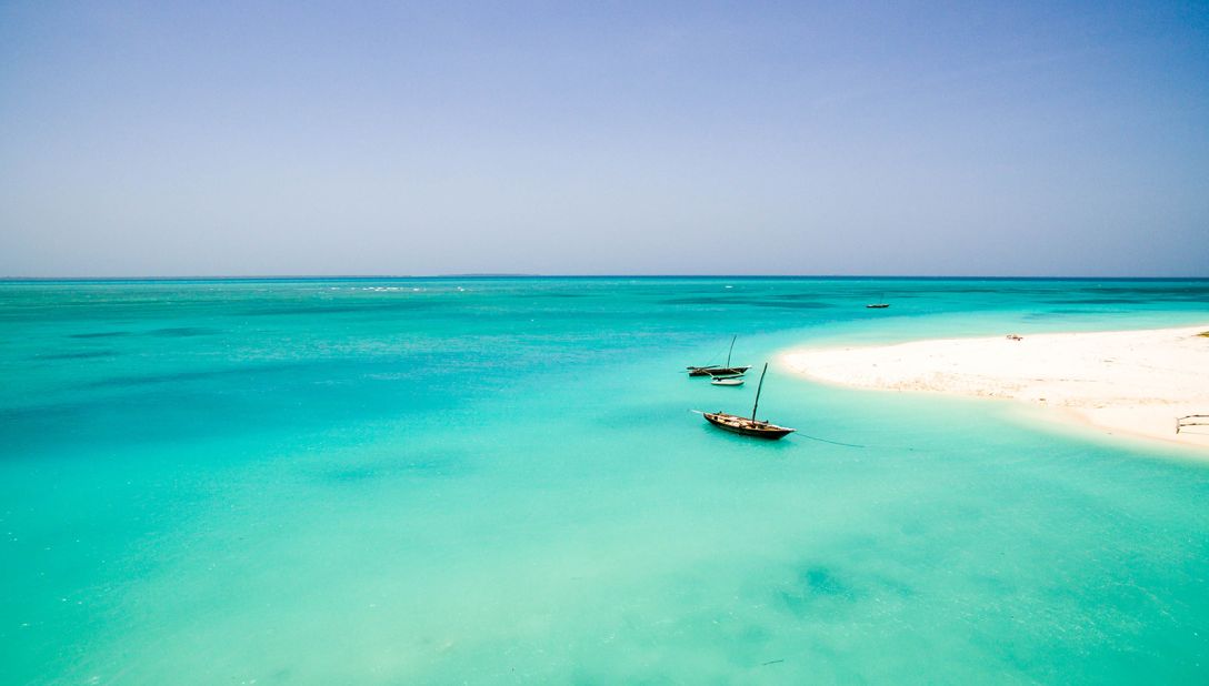 <strong>Nungwi Beach: </strong>On Zanzibar's northernmost tip, Nungwi has the kind of white coral sand that seems to glow. Photo courtesy of <a href="https://theworldpursuit.com/" target="_blank" target="_blank">TheWorldPusuit.com</a>