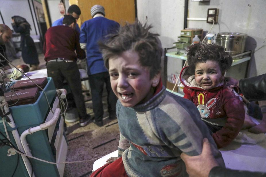 Injured children are treated at a hospital in Douma.