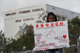 Tyra Heman, a senior at Marjory Stoneman Douglas High School, protests in front of the school where 17 people were killed on February 14.
