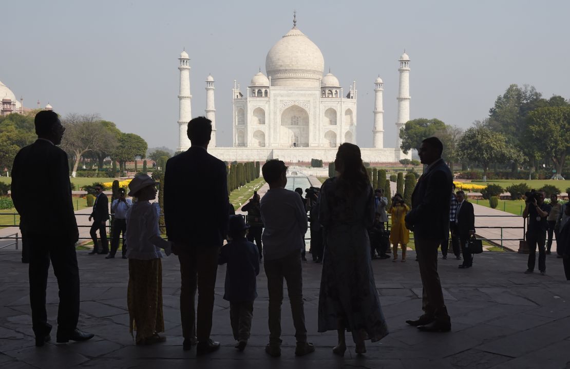 The Trudeau family stands silhouetted in front of the Taj Mahal in Agra on February 18. 
