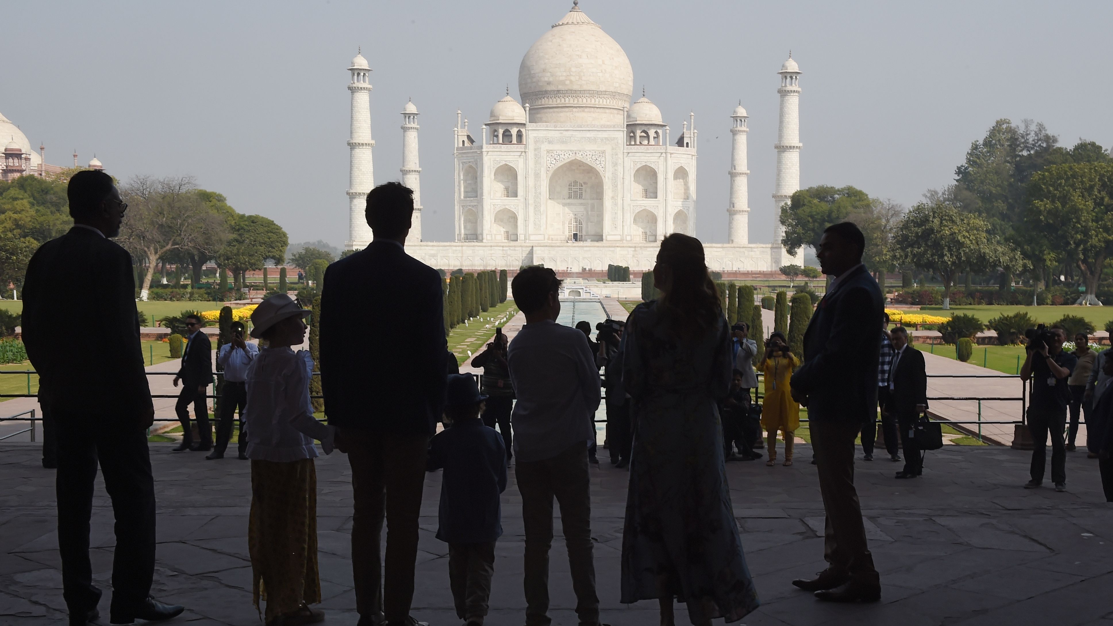 The Trudeau family stands silhouetted in front of the Taj Mahal in Agra on February 18.