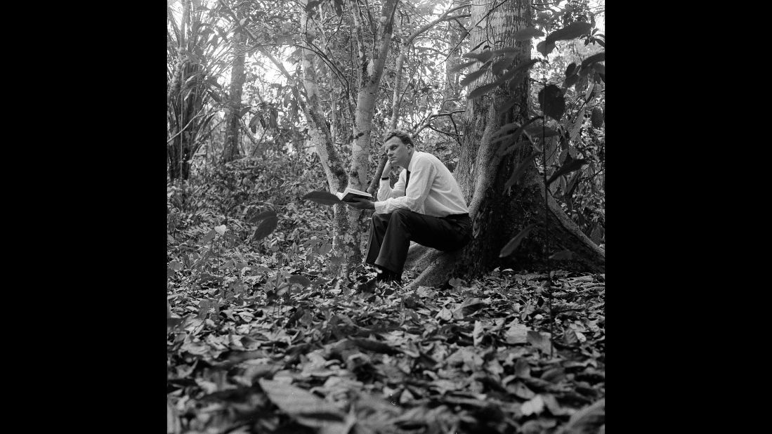 Graham sits in a jungle clearing a few miles from Ibadan, Nigeria, in 1960.