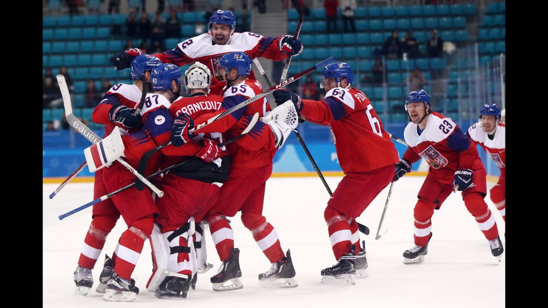 Team Czech Republic celebrates its win after an overtime shootout against Team USA. 