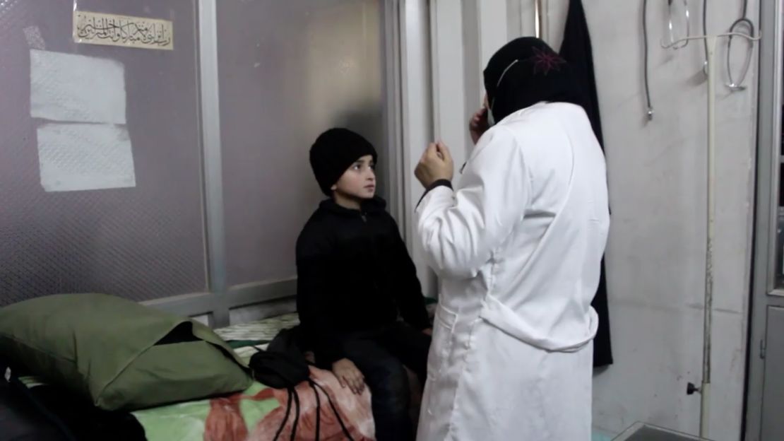 Dr. Wassem Mohammad examines a young boy in a medical facility in Eastern Ghouta. The boy needs specialized medicine not available to those under the siege.