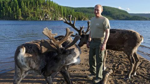 Russian President Vladimir Putin with deer in southern Siberia during a vacation in 2013.