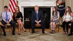 US President Donald Trump takes part in a listening session on gun violence with teachers and students in the State Dining Room of the White House on February 21, 2018.
Trump promised more stringent background checks on gun owners Wednesday as he hosted a group of students who survived last week's mass shooting at a Florida high school. / AFP PHOTO / Mandel NGAN        (Photo credit should read MANDEL NGAN/AFP/Getty Images)